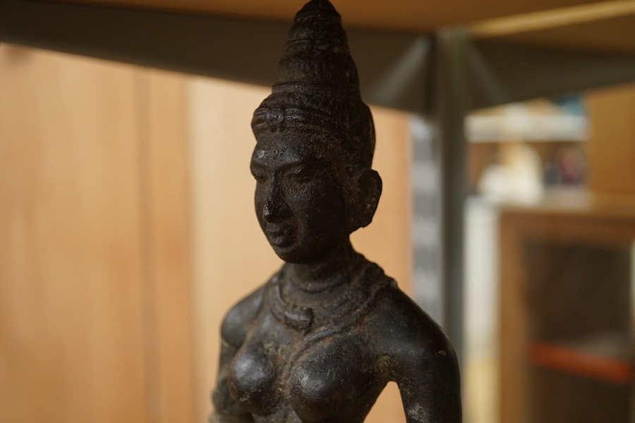 A South Indian cast iron figure of Parvati, 34cm high. Condition - fair